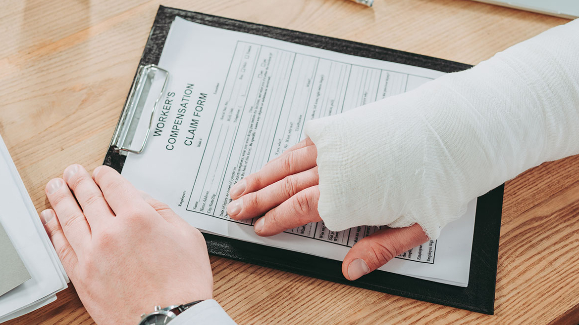 Person reviewing workers compensation form